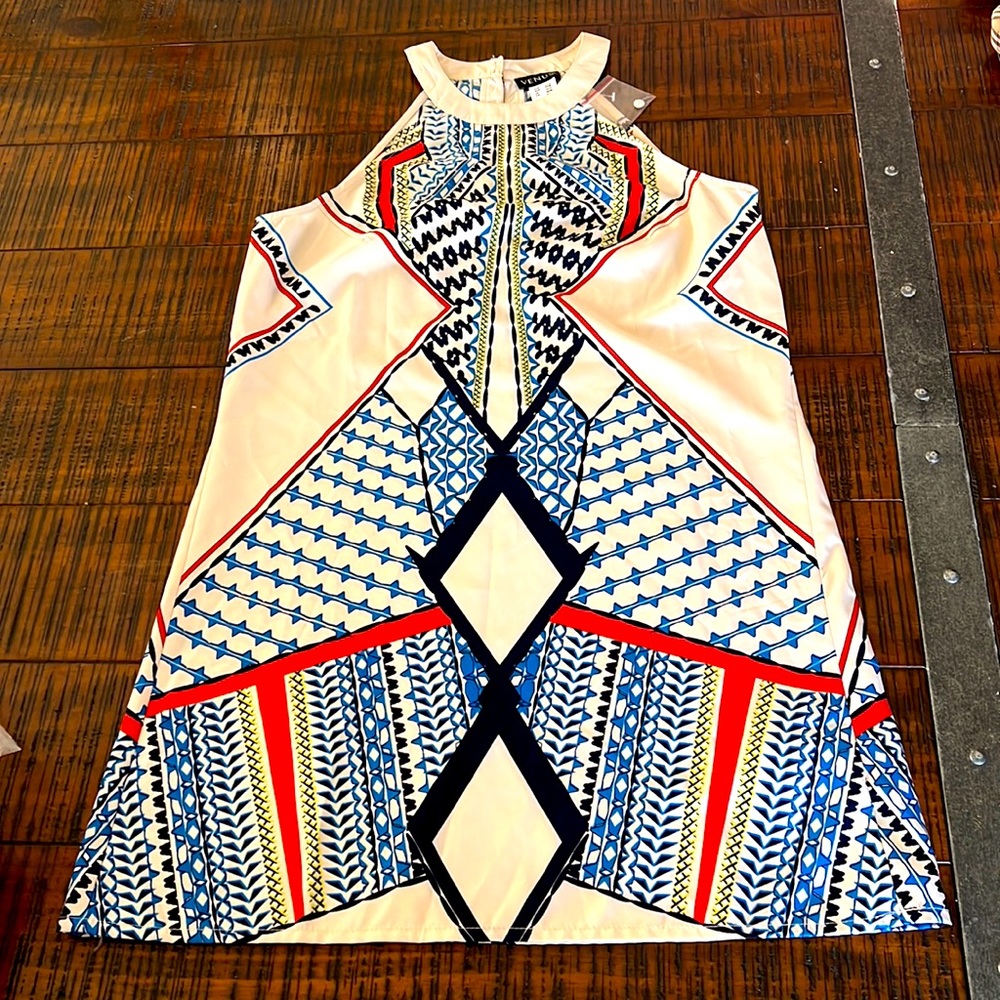 Cute short dress. Multi colored. Never worn
